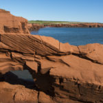 Red cliff facing the Atlantic Ocean in Canada.