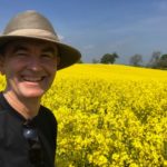 Happy hiker and rapeseed