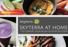 The cover of a book, called, Skyterra at Home The Cookbook: Simple Recipes to Elevate Your Meals with images of various bowls of food in the background and surrounding the title.